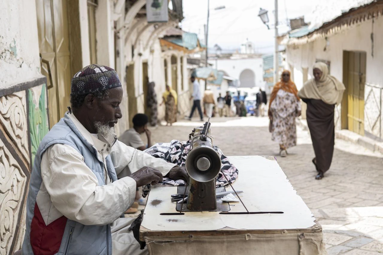 A street tailor at work in the UNESCO-listed walled city of Harar Jugol, Ethiopia