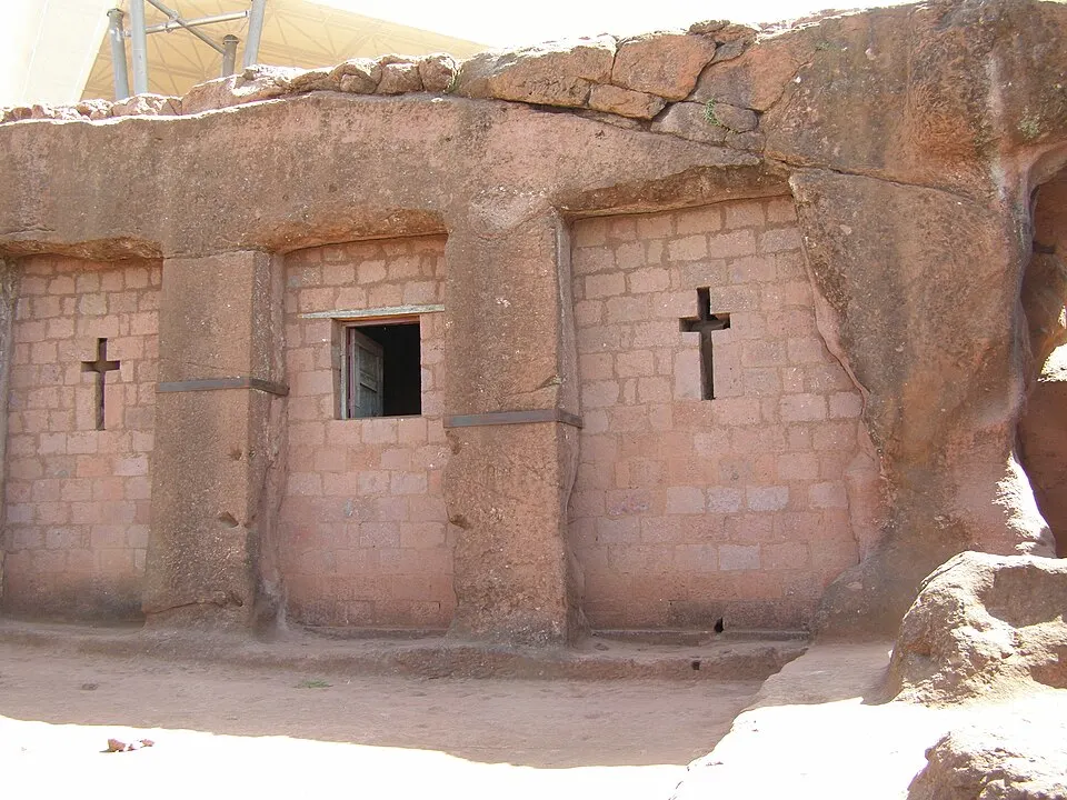 Carved cross-shaped window in a rock-hewn church wall, Lalibela, Ethiopia