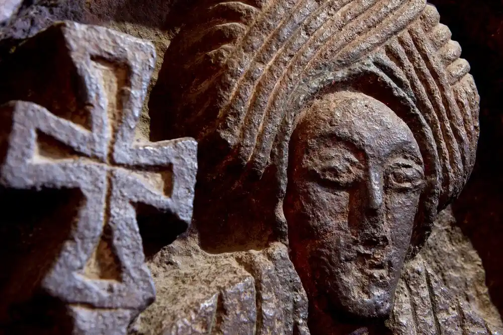 A rock-hewn church nestled within its excavated courtyard in Lalibela, Ethiopia